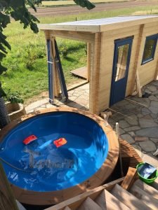 Fiberglass lined hot tub with integrated burner thermo wood Wellness Royal