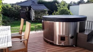 Outdoor whirlpool hot tub with Smart pellet stove